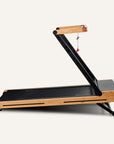 Tapis de course pliable en Z | Bois de chêne certifié FSC® | Moteur brushless jusqu'à 18 km/h | Inclinaison jusqu'à 12 % | Compatible application